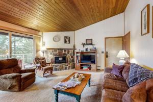 a living room with a couch and a table at Bay Point Hillside 17A Up in Whitefish
