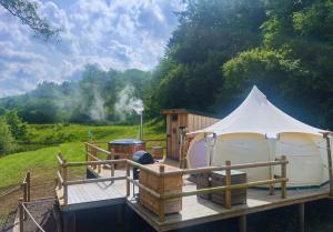 a white tent sitting on top of a wooden deck at Roden Retreat in Aston +13 photos