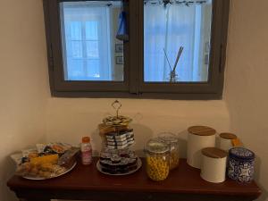 a table with food on it with a window at Villa Ca' Vegia in Stresa