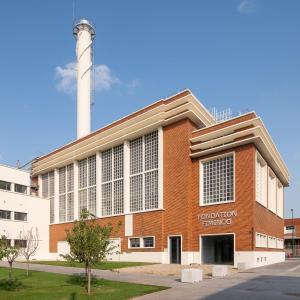 a brick building with a silo on top of it at Luxury Studio - Romainville in Romainville