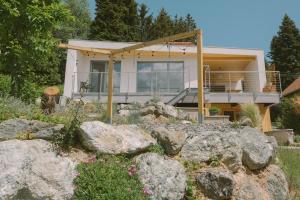 a home with rocks in front of it at Well M cottage in Velem