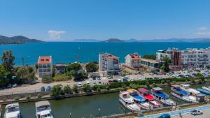 a city with boats docked next to a body of water at Mia Casa Hotel in Fethiye