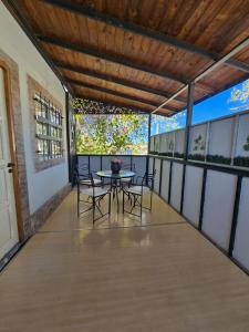 a patio with a table and chairs on it at Departamento en San Juan Capital 3 dormitorios hasta 6 personas in San Juan