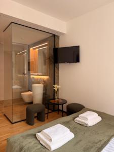 a room with a bed and a bathroom at Kamea in Poznań +36 photos