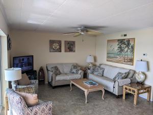 a living room with couches and a coffee table at 210 Worcester St #203 OC in Ocean City
