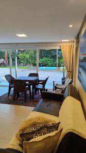 a living room with a couch and a table at Casaloft994 in Bento Gonçalves