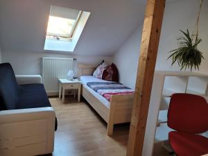 a small bedroom with a bunk bed and a ladder at Bella Vista in Burgstaedt +10 photos