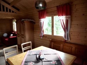 a dining room with a table and a window at Ferienhaus Holzhaisl in Kelheim