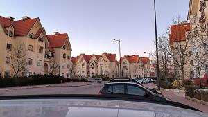 a car parked in front of a row of houses at Rez de chaussée in Ifrane