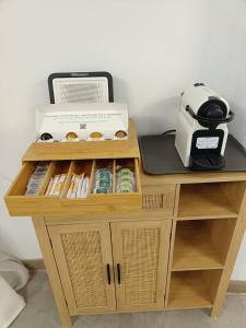 a small wooden table with a box and a toaster at Casa Rural Las Alcusa in Cubla