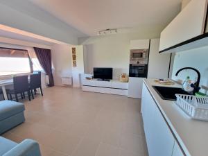 a kitchen and living room with a couch and a table at INFINITY VIEW 8 Lozenets in Lozenets