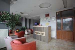 a reception room with chairs and a reception desk at Gulistan Hotel in Zara