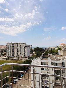 a view of a city from a balcony of a building at Good Inn in Bar