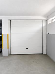a large white garage door with a window at PORTO AGUDA BEACH ***** in Arcozelo