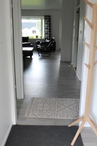 a hallway with a door open to a living room at Pikkurinki 27 As 2, Härmä in Härmä