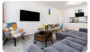 a living room with a couch and a table at Downtown Apartment in Bonn