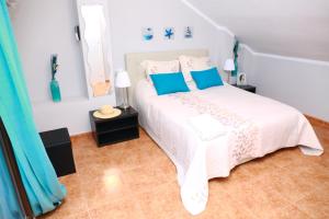 Ένα ή περισσότερα κρεβάτια σε δωμάτιο στο Villa de Mediterraneo Cullera