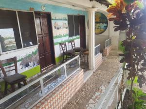 a room with a fish tank on the side of a building at baobolong ghuesthouse in Lamin Koto