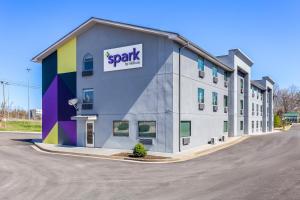 a large building with a sign on the side of it at Spark By Hilton Beckley in Beckley