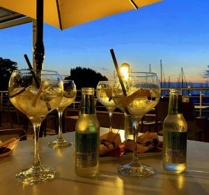 a group of wine glasses and bottles on a table at Cà in Laguna in Chioggia