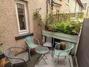 a group of chairs and tables on a patio at The Haven in Morecambe