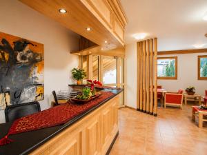 a kitchen with a counter and a dining room at Hotel-Aparthotel San Bernardino in San Bernardino