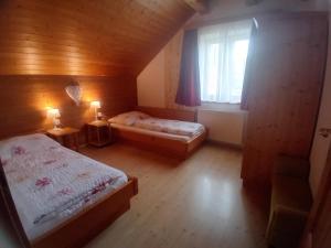 a small bedroom with two beds and a window at Urlaub am Bauernhof Gänser in Sankt Peter am Kammersberg +37 photos