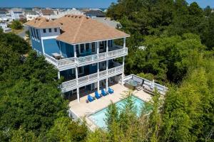 an aerial view of a house with a swimming pool at VOH151 FINALLY in Corolla