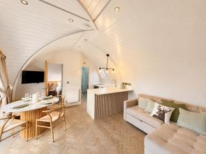 a living room with a couch and a table at Leisure Lodges in Glastonbury