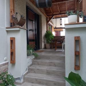 a hallway of a house with stairs and plants at Sofija apartments in Gevgelija