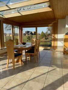 a dining room with a table and chairs at Landzeit in Efringen-Kirchen +18 photos