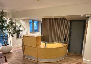 a room with a reception desk in a building at Fenwick Street Hotel by EPIC, Central Rooms Near Waterfront & Liverpool ONE in Liverpool +17 photos