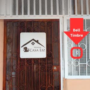 a sign on the door of a building at Casa Liz in Managua