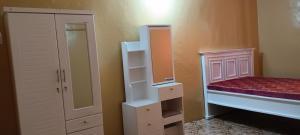 a small bedroom with a bunk bed and a closet at Michenzani rooms apartment in Ngambo