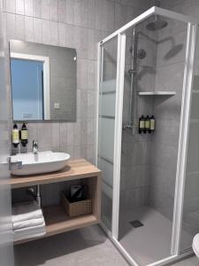 a bathroom with a shower and a sink at La LLar in Carboneras