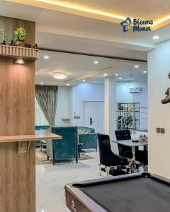 an office with a pool table in a room at Blooms Manor Apartment in Lagos