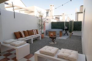 a living room with couches and a table at Sout Huijs Langebaan with hot tub in Langebaan