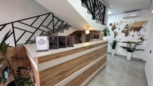 a restaurant with a counter with signs on it at Gatsby Djal in Bishkek