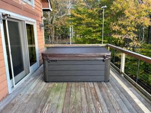 a large chest on a deck on a house at Resting on the Ridge in Beech Mountain