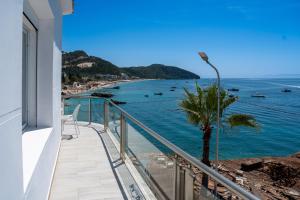 a balcony with a view of the ocean at Hotel Riviera Dhermi in Dhërmi