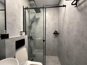 a bathroom with a shower and a toilet at Тихий Замок Джал in Bishkek