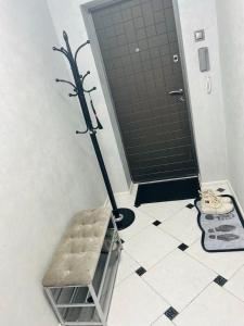 a bathroom with a shower with a mop on the floor at Comfort VV in Volodymyr-Volynskyi