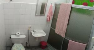 a bathroom with a sink and a toilet and a shower at Rio Private Budget Suite & Easy Transport Access in Rio de Janeiro