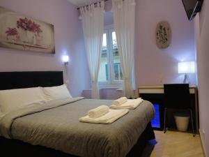 Postel nebo postele na pokoji v ubytování Guest House Le Tre Spezie