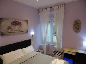 Postel nebo postele na pokoji v ubytování Guest House Le Tre Spezie
