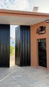 a building with black doors and a sign on it at Dar Julia in Sousse