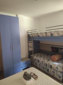 a bedroom with two bunk beds and a closet at CASA BETTO in San Domenico
