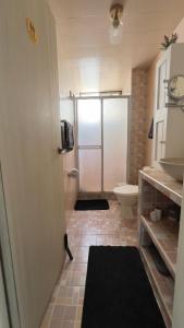 a bathroom with a shower with a sink and a toilet at Edificio Genesis in Rodadero