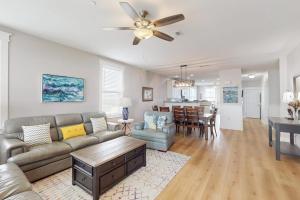 a living room with a couch and a table at Sand Swept in Galveston