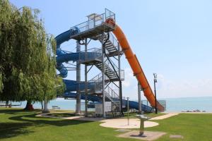 a water slide in a park next to the ocean at Sétány Apartman in Csopak